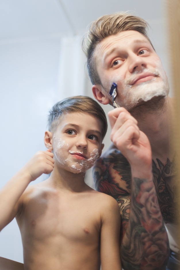 man shaving next to his son 23 2147624677