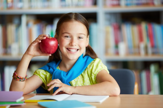 smiling girl with an apple 1098 2602